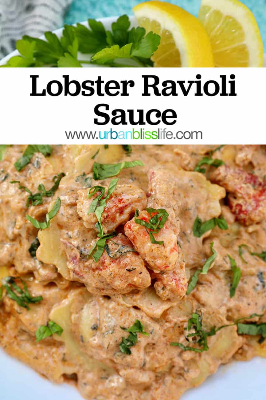 lobster ravioli sauce with lobster meat, lemon wedges, and herbs in a white bowl.