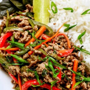 Thai basil beef with red peppers, green onions, and white rice.