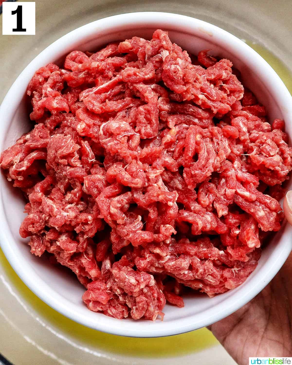 ground beef in a white bowl.