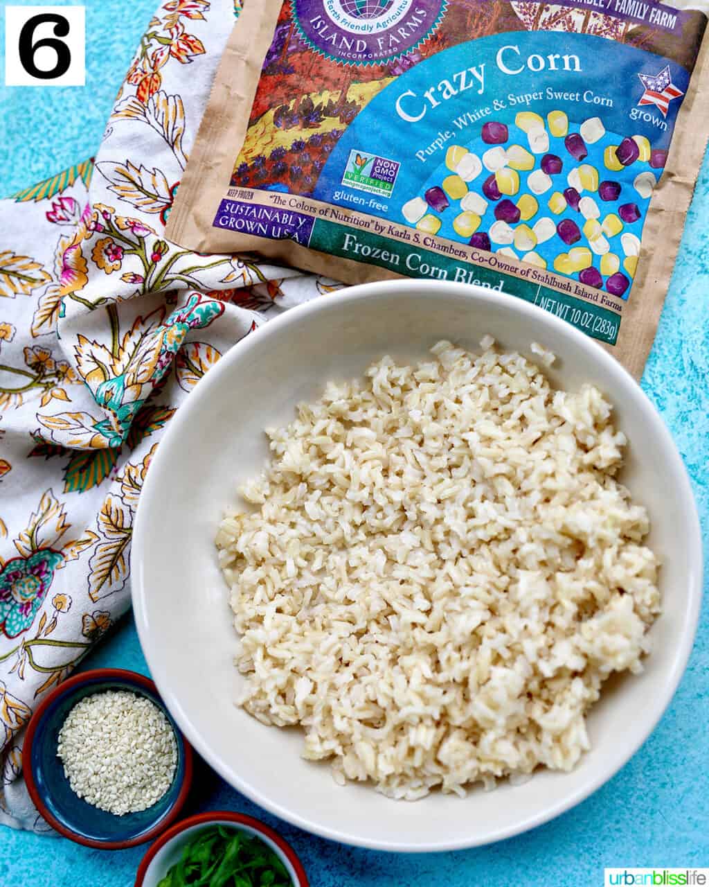 brown rice in a large bowl with package of frozen corn.