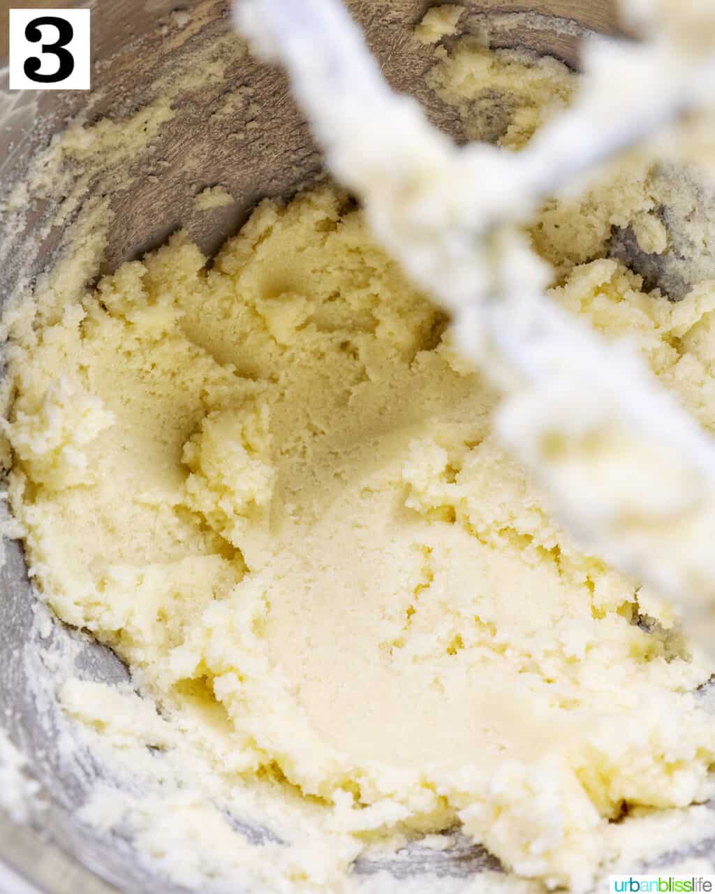 softened butter creaming in the bowl of a stand mixer.