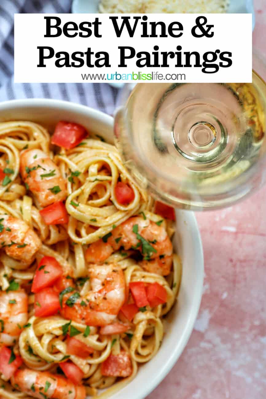 glass of white wine next to a bowl of cajun shrimp pasta with title text that reads "Best wine and pasta pairings."