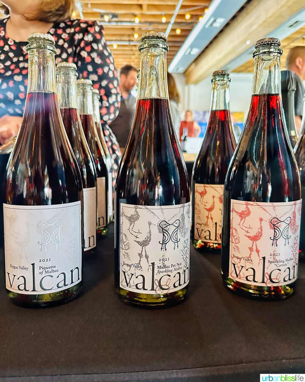 wine bottles of Valcan Cellars wines on a table.