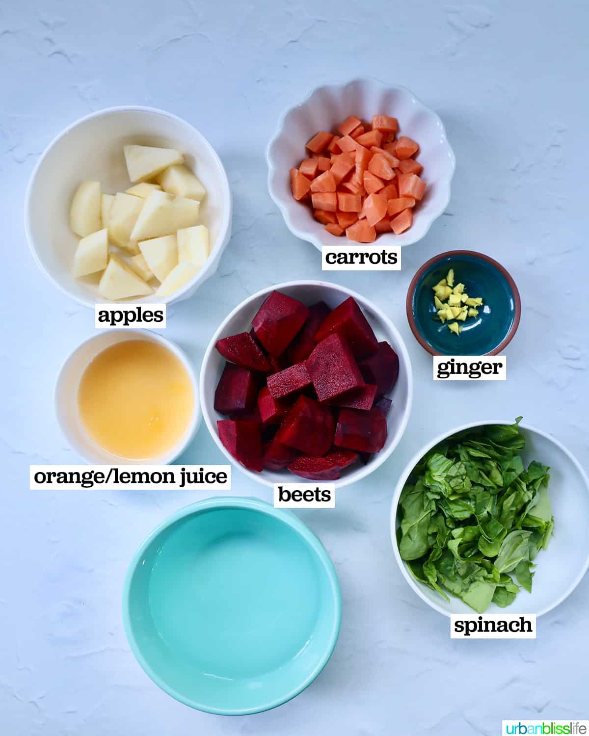 bowls of ingredients to make beet detox juice.