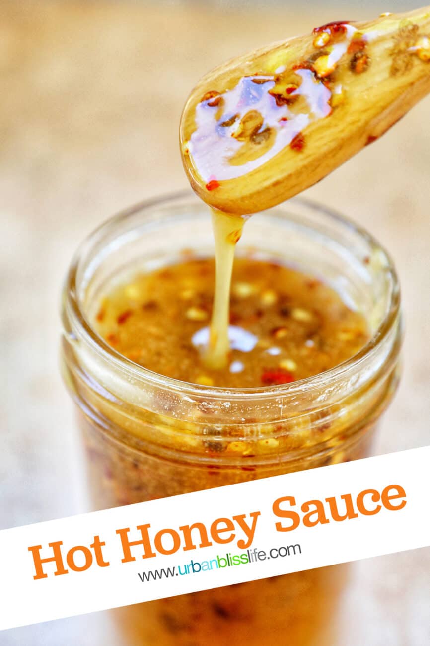 honey spoon lifting hot honey sauce out of a mason jar with title text that reads "hot honey sauce" and Urban Bliss Life logo.
