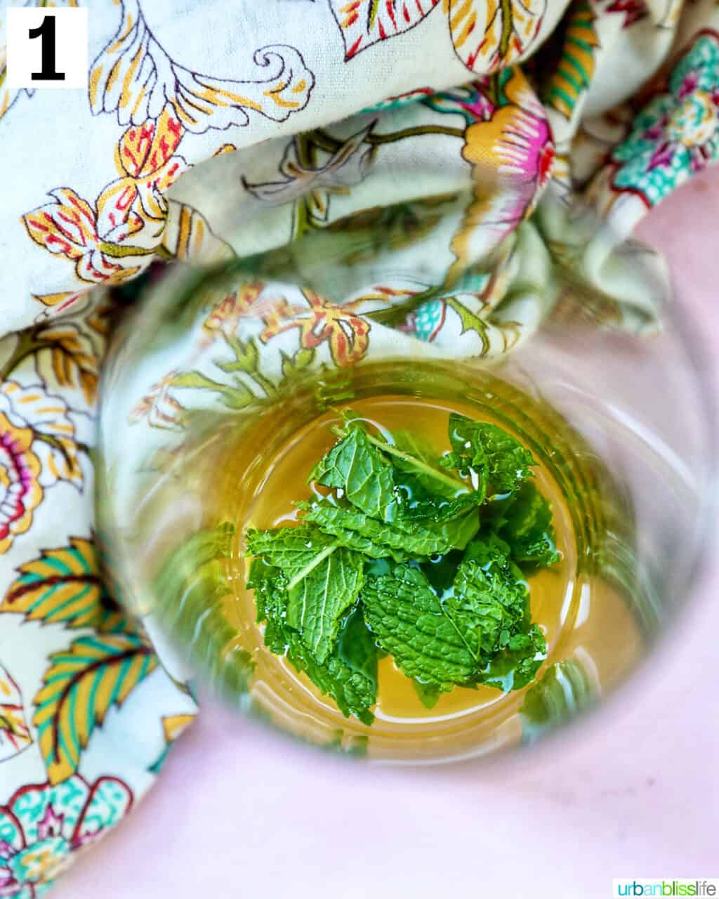 mint leaves on top of mango mojito cocktail.
