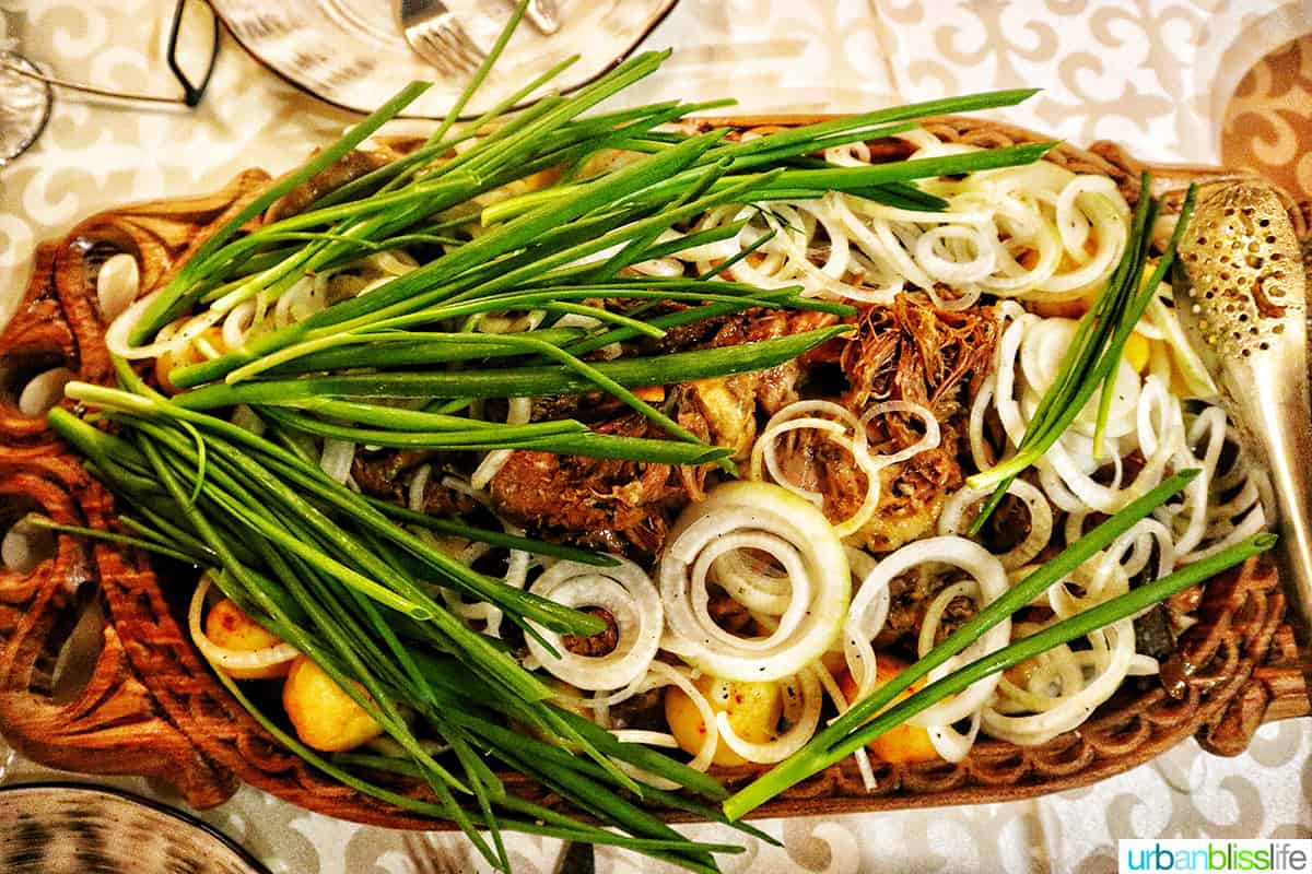 large platter of sirne, a Kazakhstan delicacy dish of lamb and potatoes.