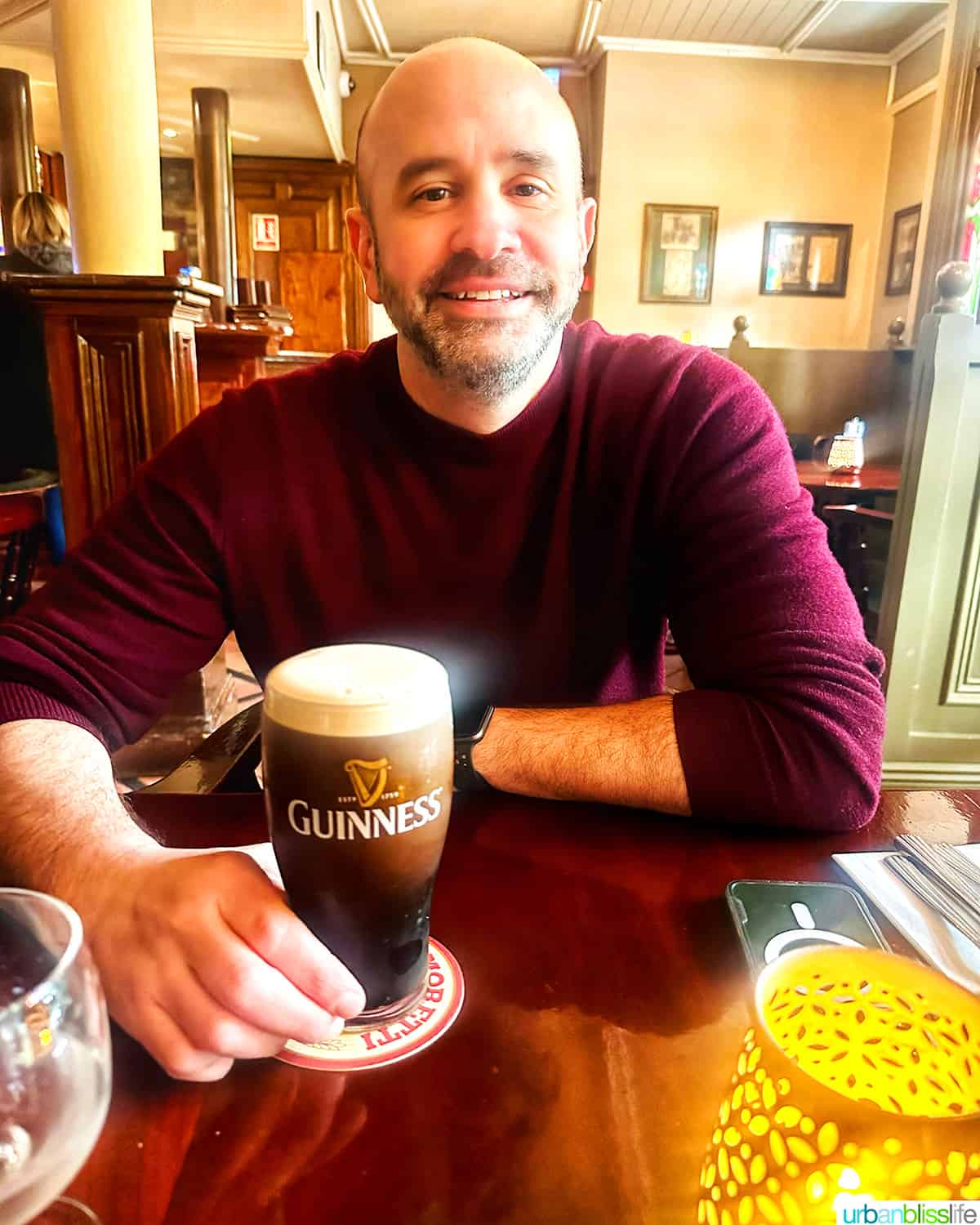 drinking a guinness at Hannigan's Bar & Restaurant in the International Hotel in Killarney, Ireland