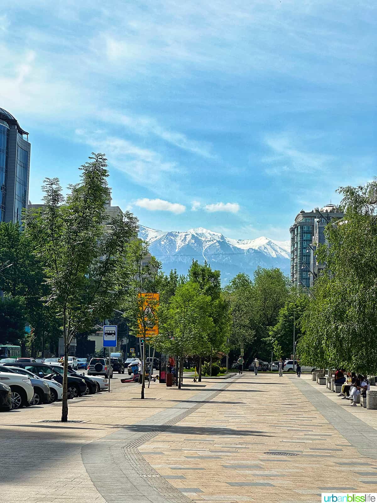 Almaty city street with mountains in the background
