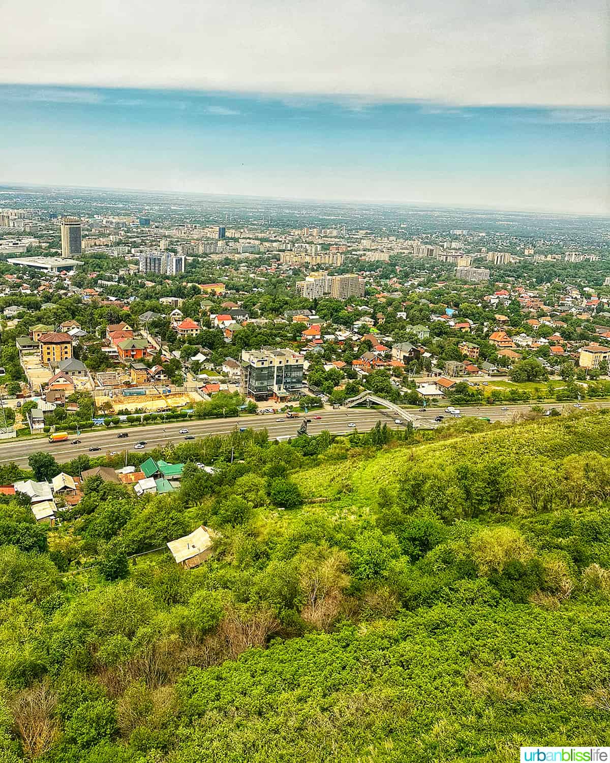 view of Almaty city from the gondola cable car up Kok Tobe hill.