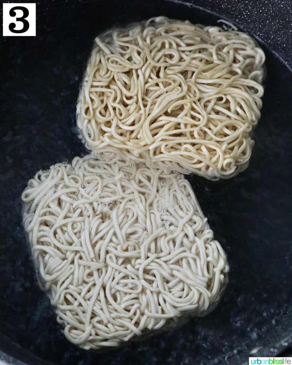 chow mein noodles in a pot of water.