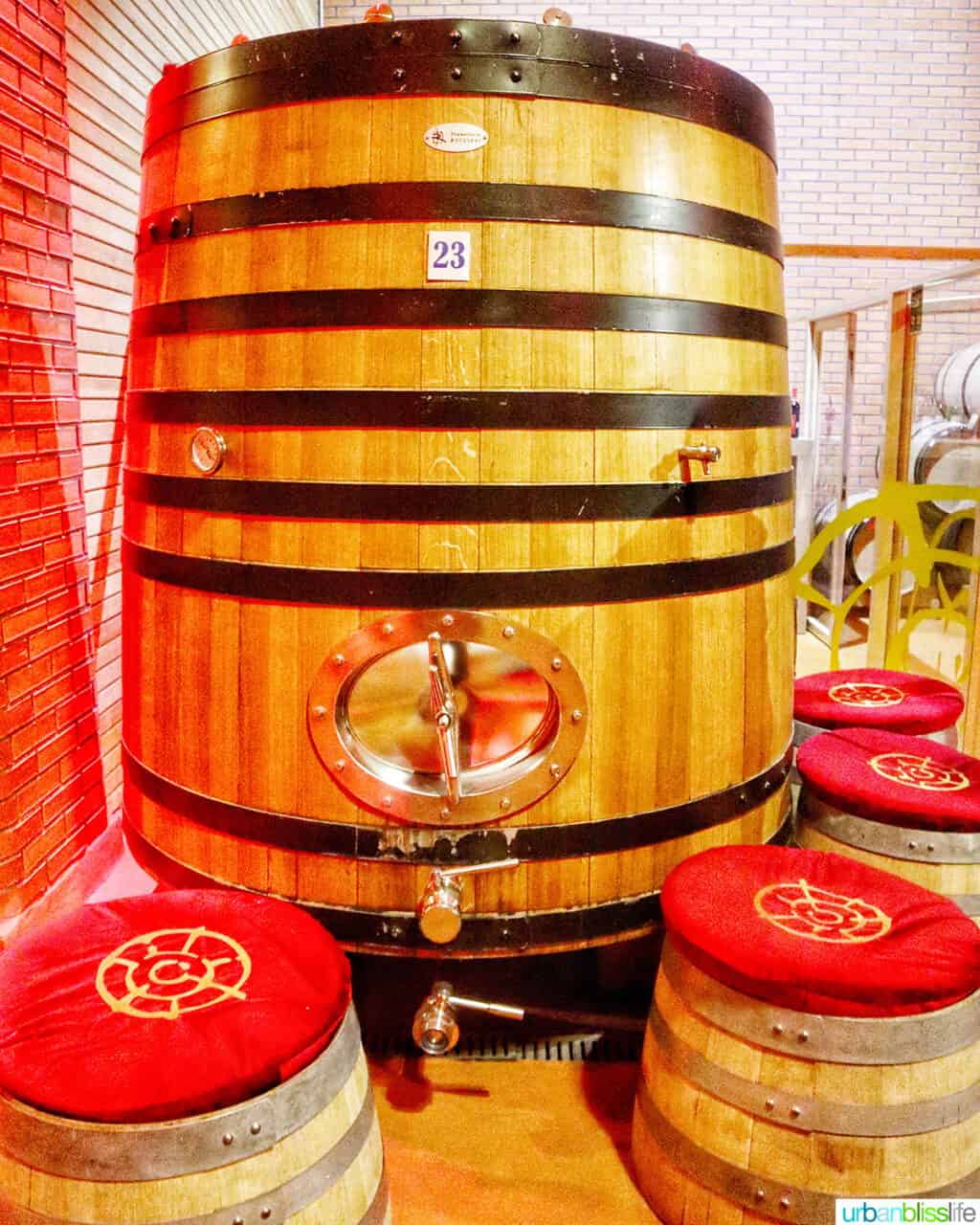 large wine barrel with wine barrel seating at Arba winery in Kazakhstan.