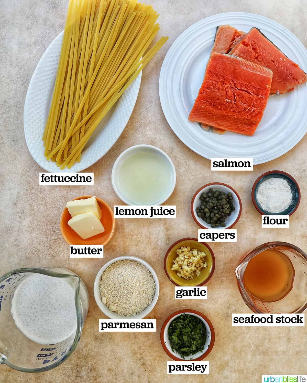 bowls of ingredients to make salmon pasta.