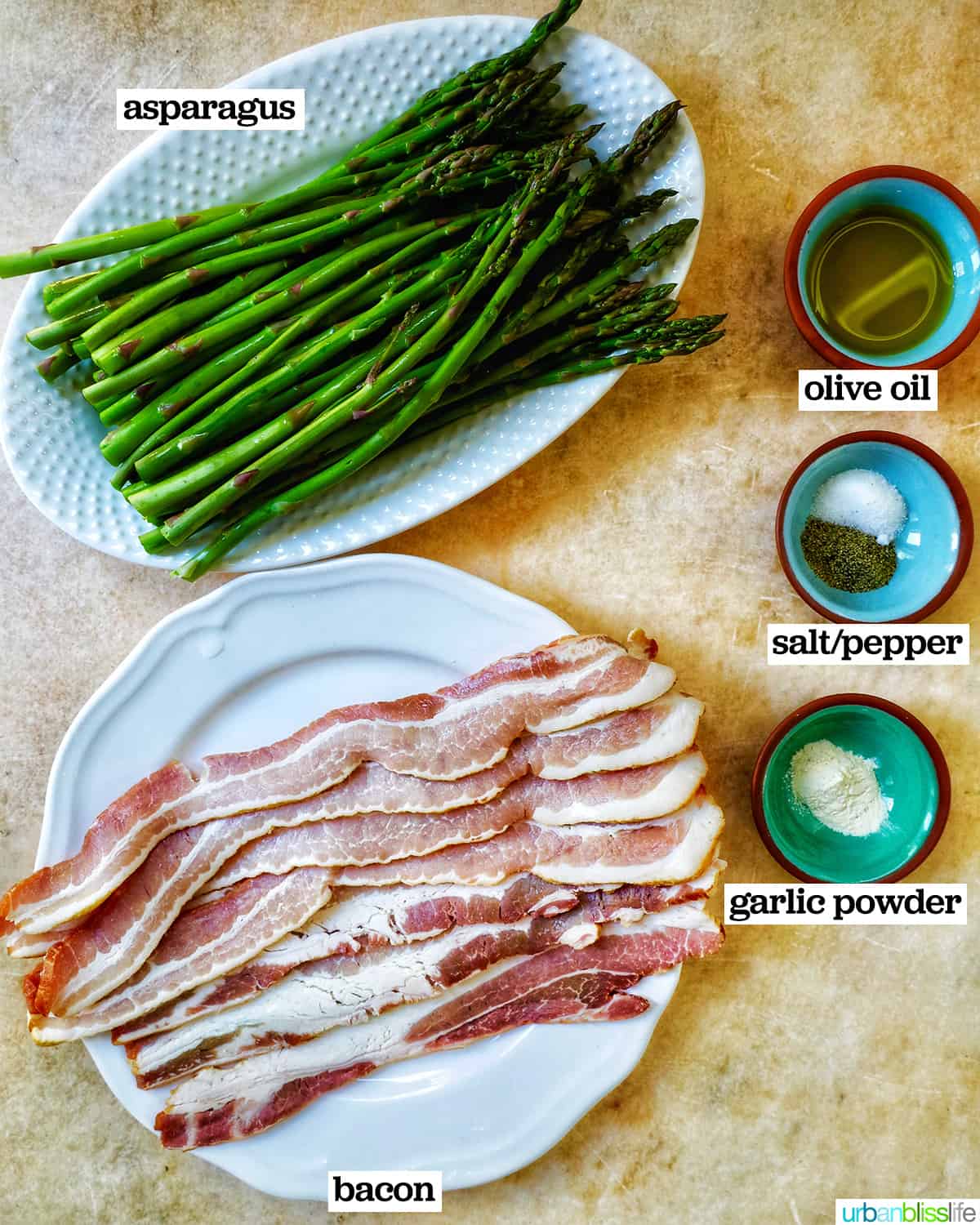 plates with bacon, asparagus, and seasonings.