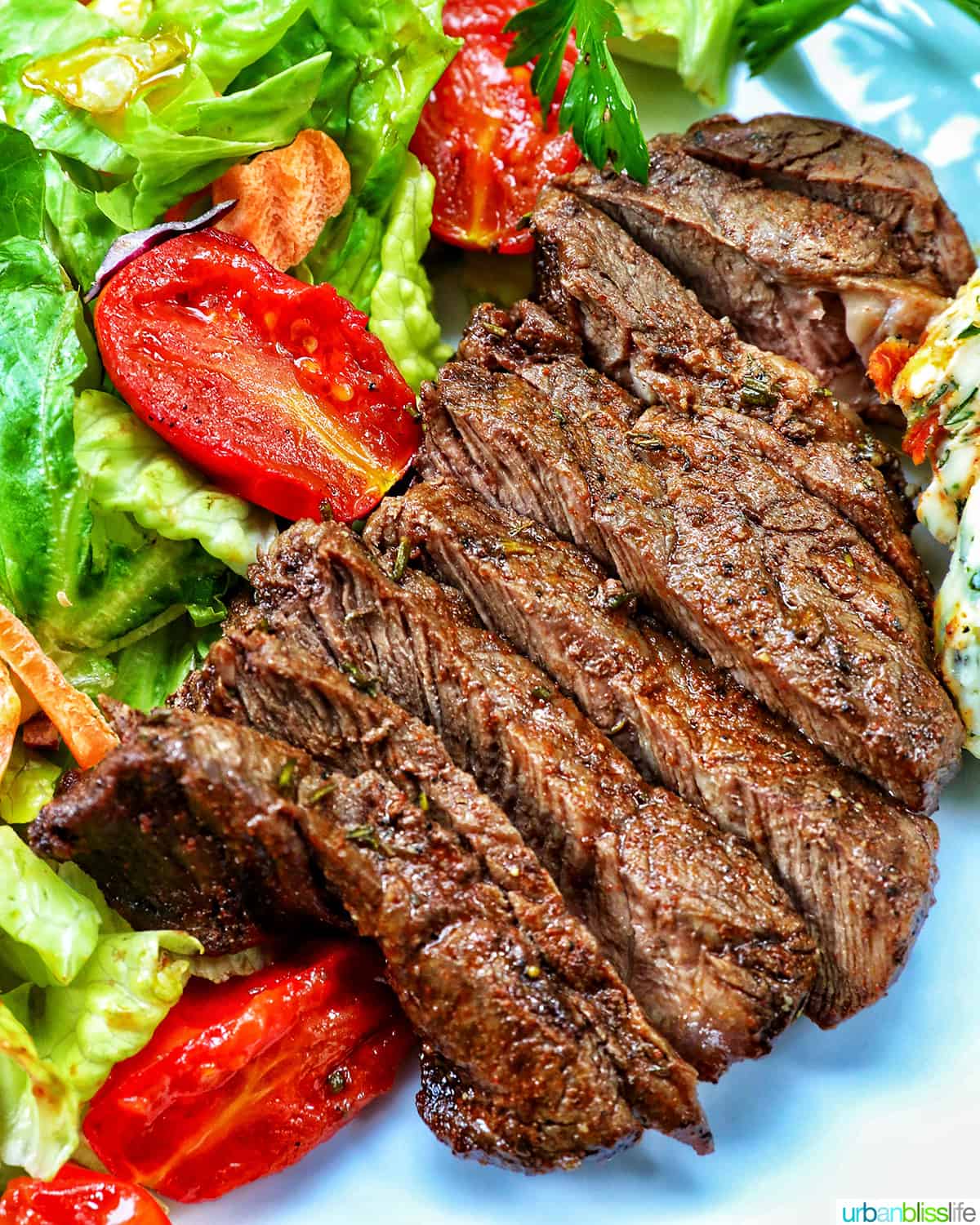 filet mignon sliced with salad.