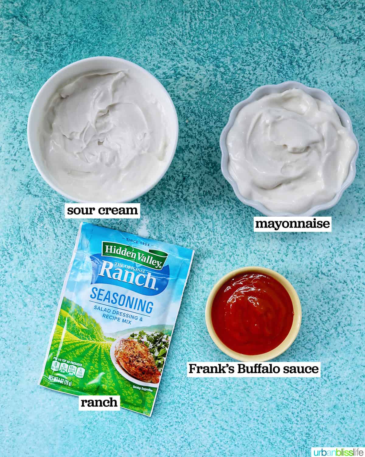 bowls of ingredients and a packet of ranch dressing mix to make buffalo ranch sauce.