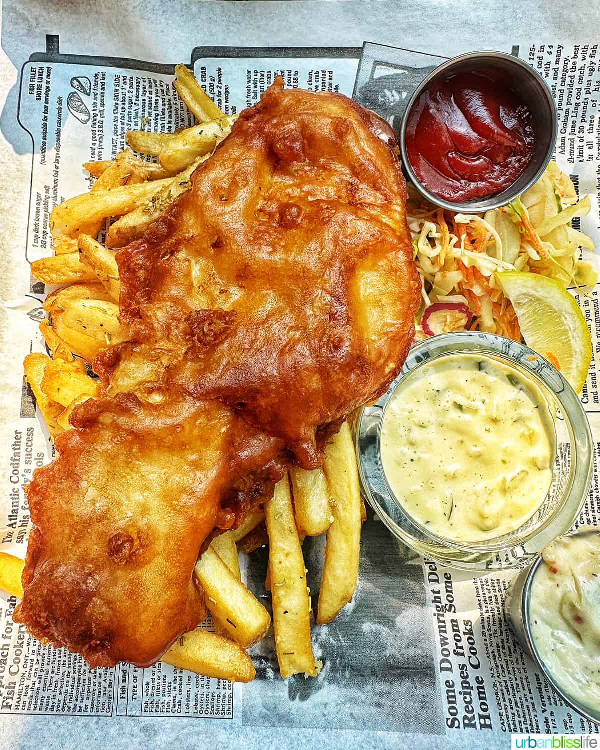 fish and chips with sauces at Dubh Linn Gate Pub in Whistler BC Canada.
