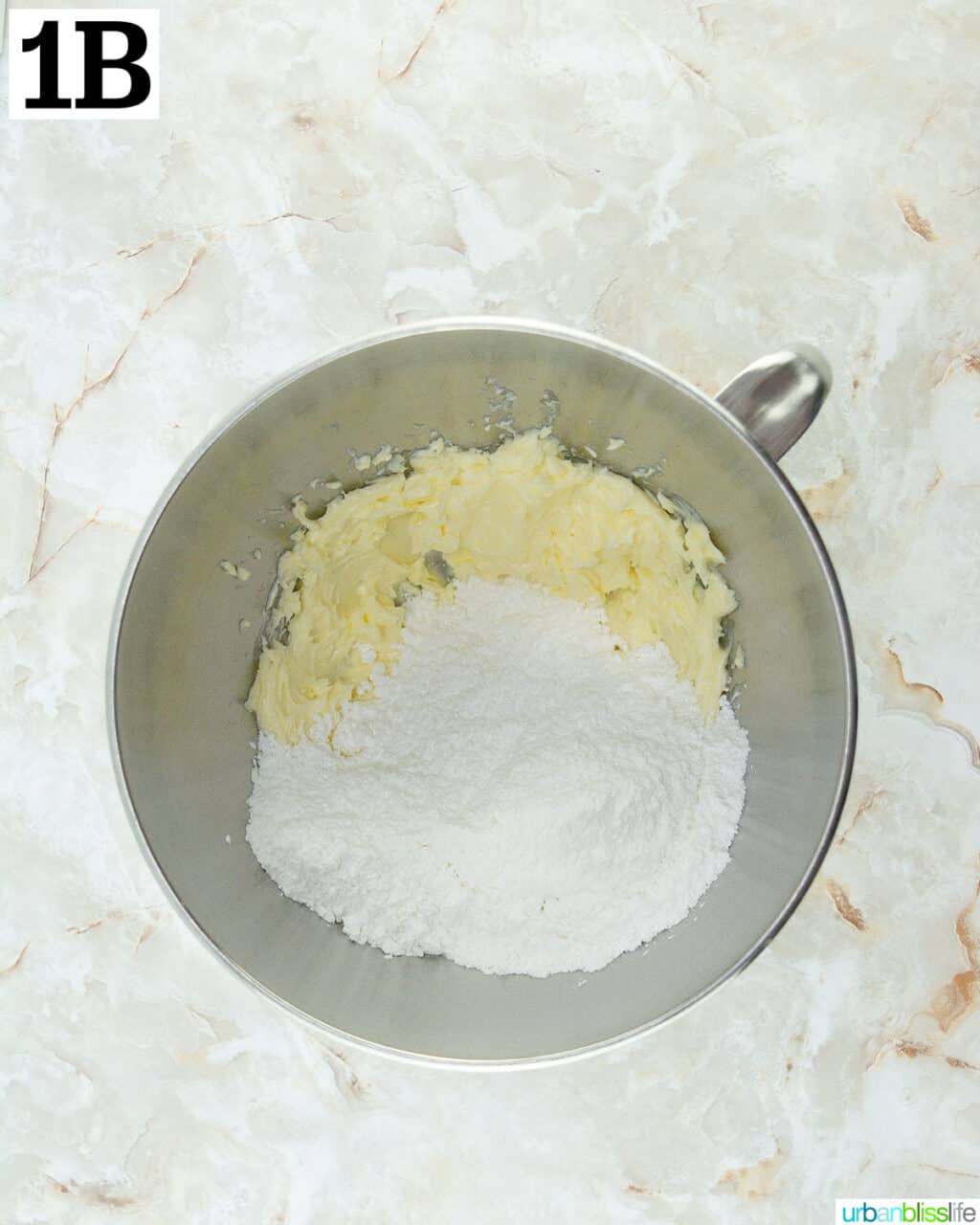 butter and sugar in a stainless steel stand mixing bowl.