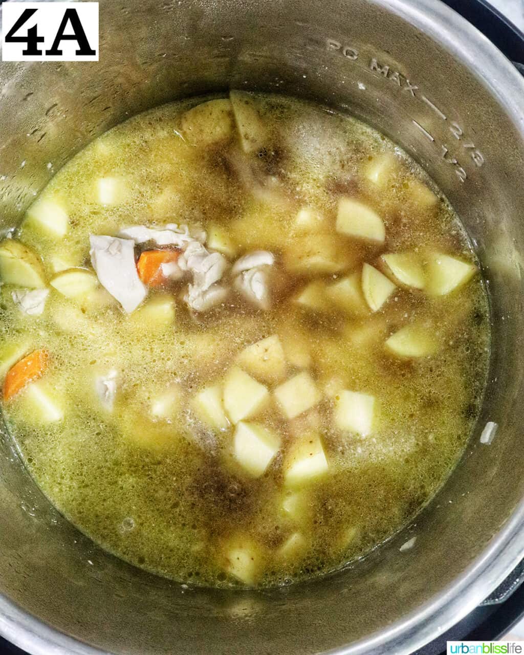 potatoes and chicken broth added to chicken pieces in an instant pot.