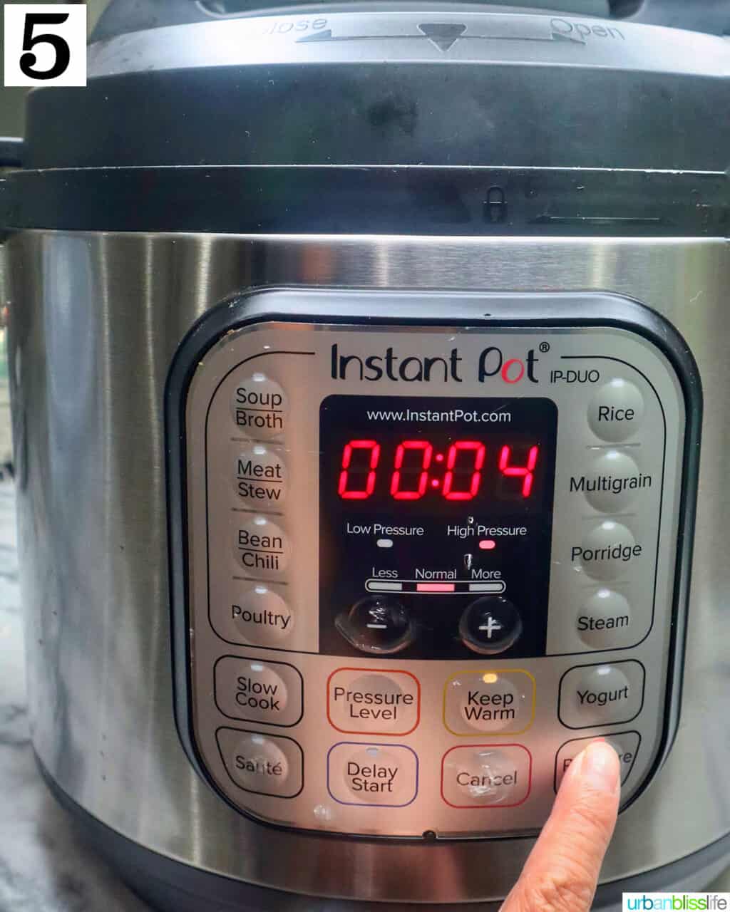 finger pressing start on an instant pot set to pressure cook on high for 4 minutes.