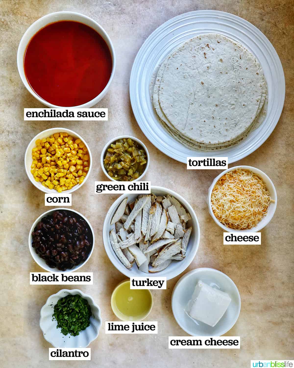 bowls of ingredients to make leftover turkey enchiladas casserole.