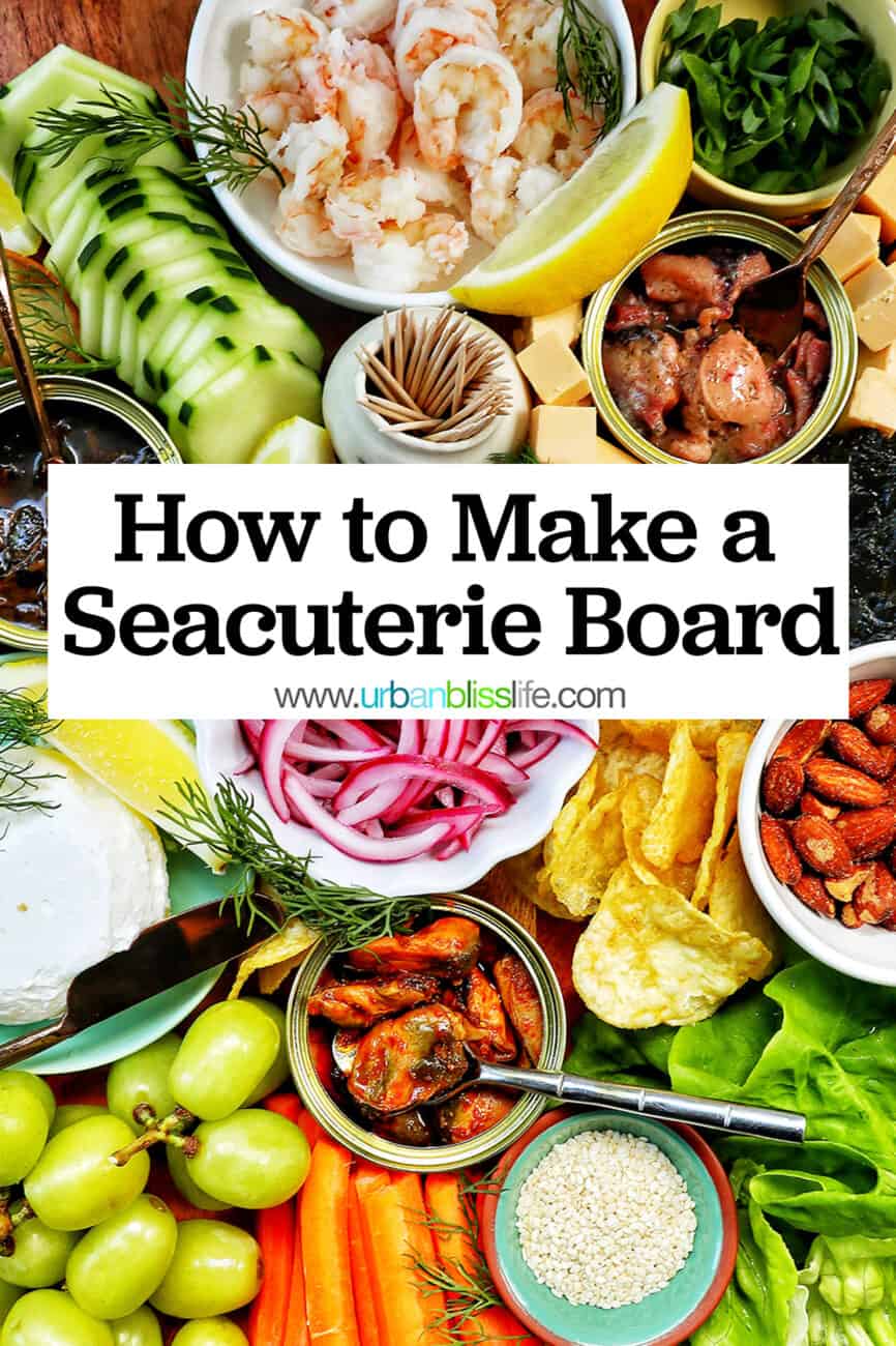 seafood board with tinned fish, fruits, vegetables, chips, crackers, and garnishes with title text "How to Make a Seacuterie Board."