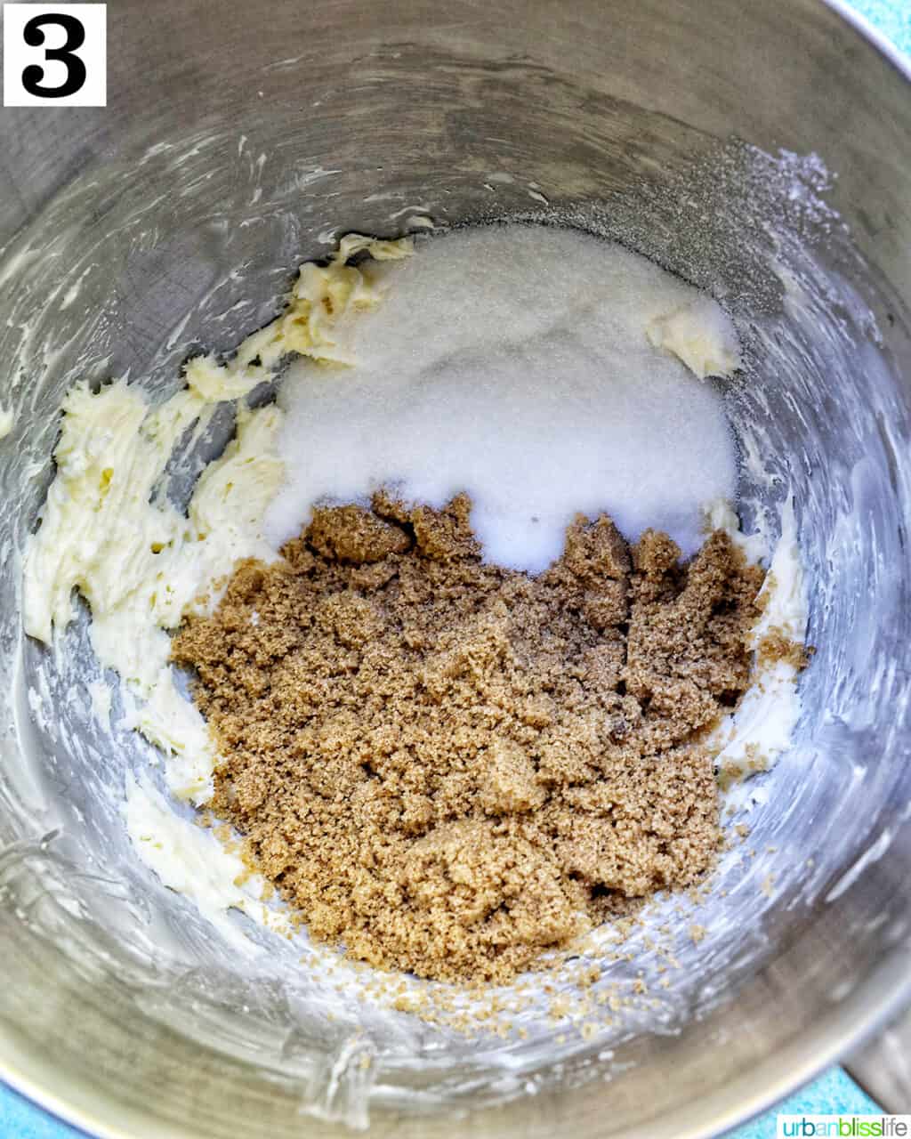 brown sugar and granulated sugar added to creamed butter in a stand mixer bowl.