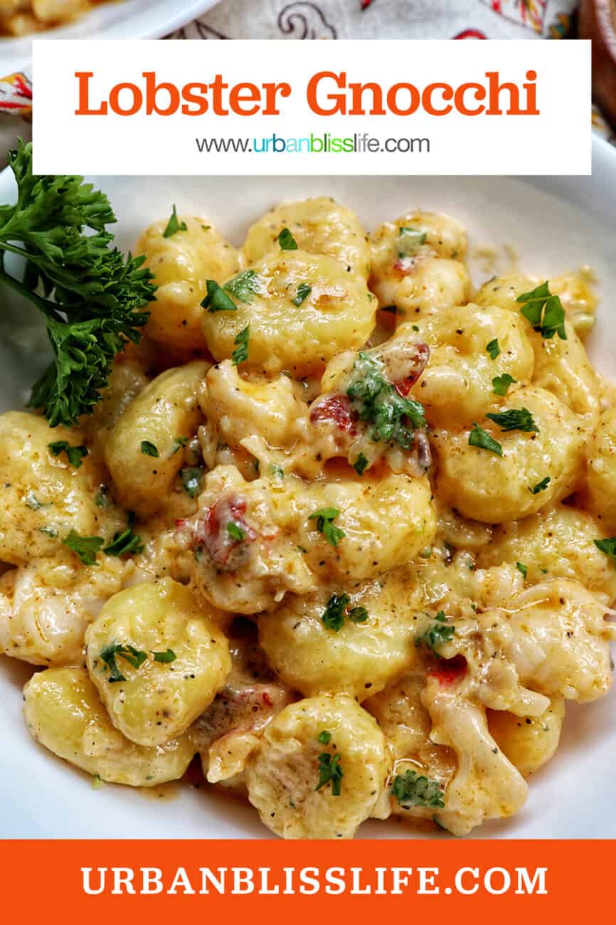 lobster gnocchi with herbs in a white bowl with title text.
