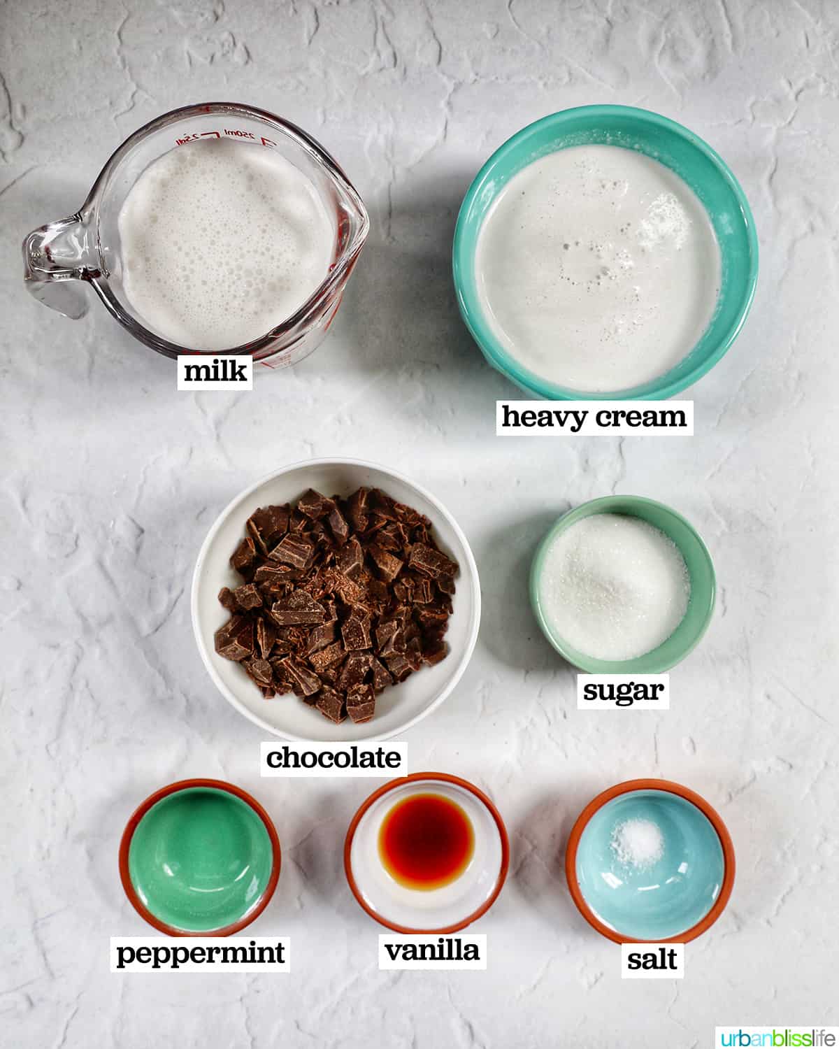 bowls of ingredients to make peppermint hot chocolate.