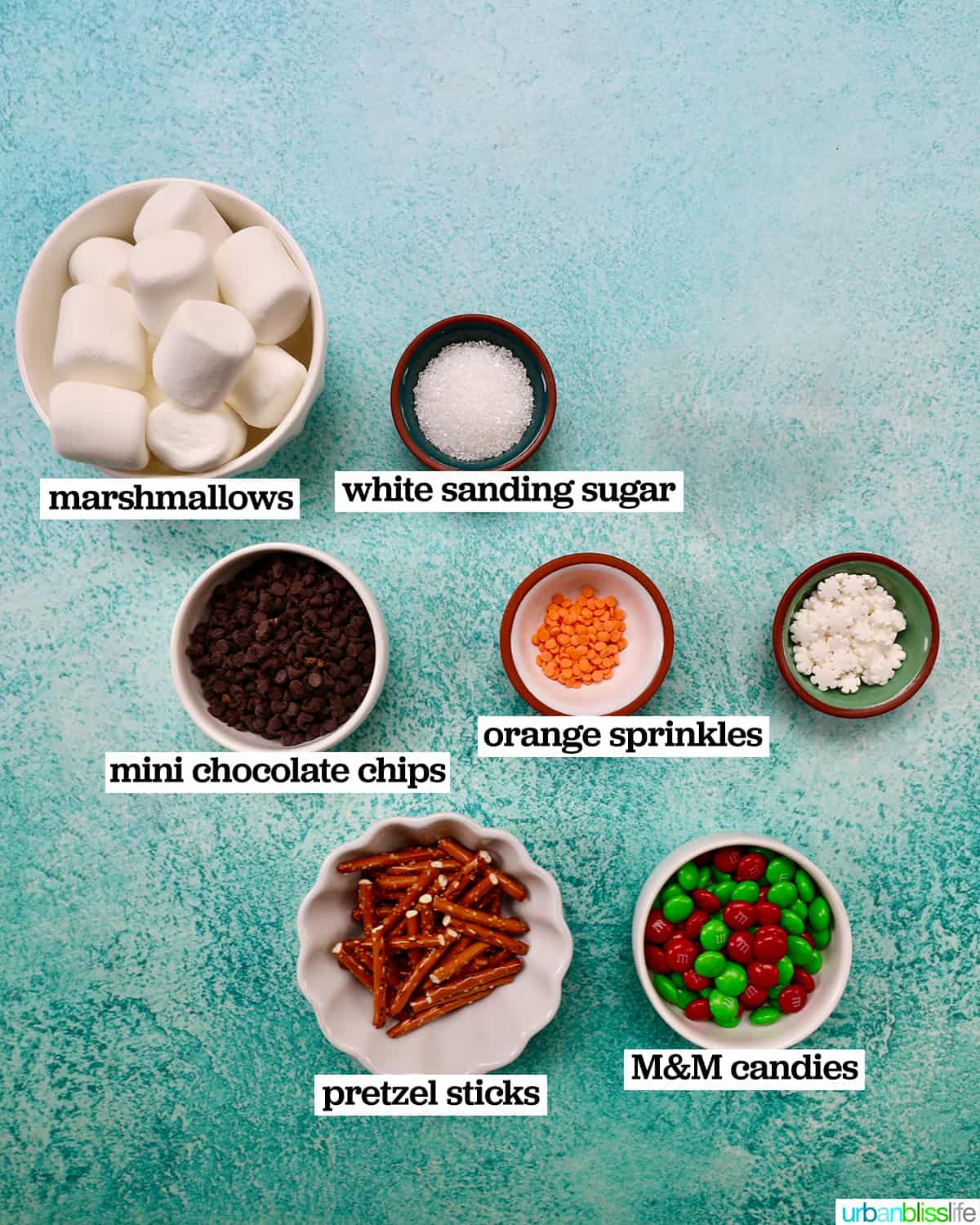 bowls of ingredients to make snowman cupcakes.