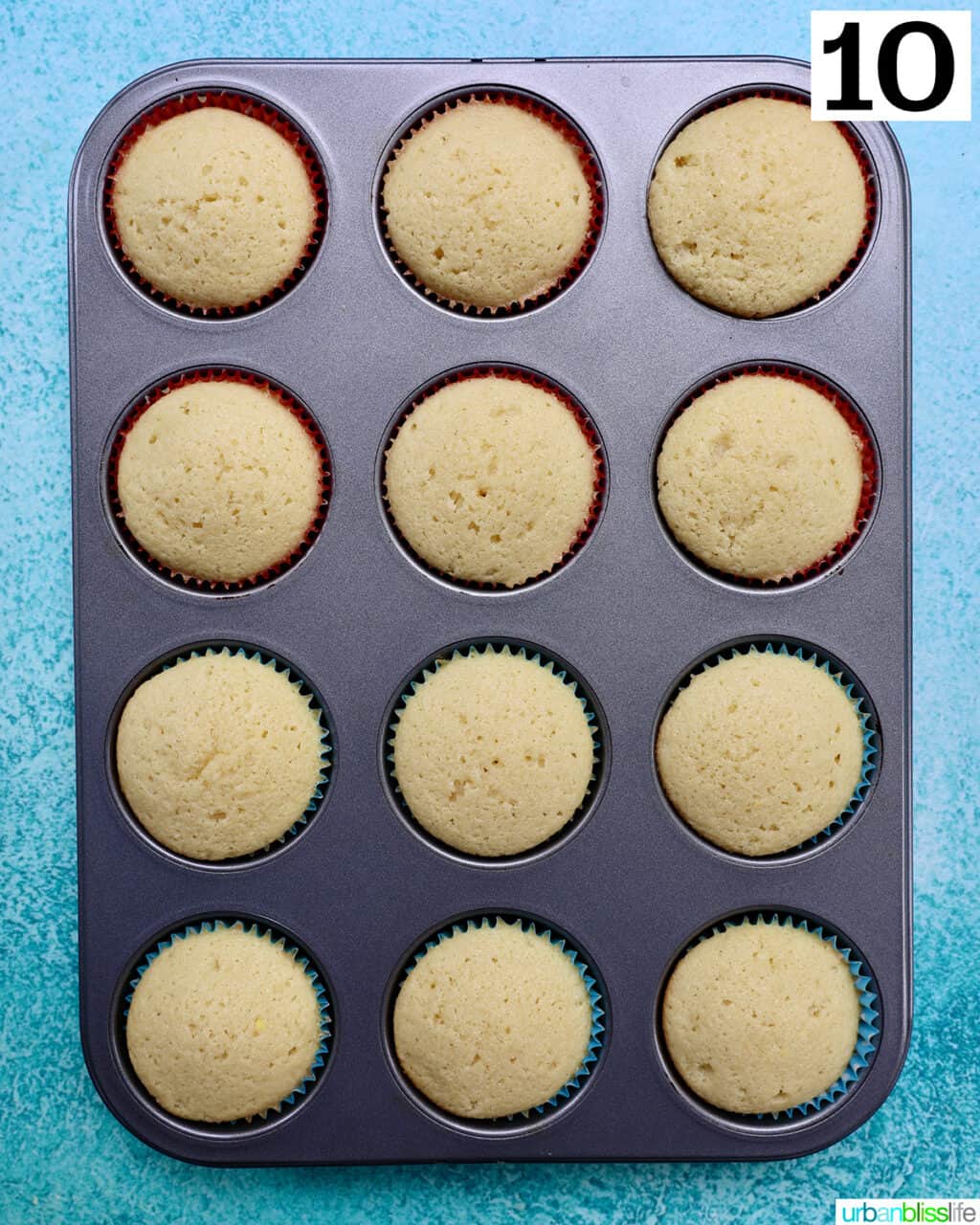 muffin tin filled with vanilla cupcakes.
