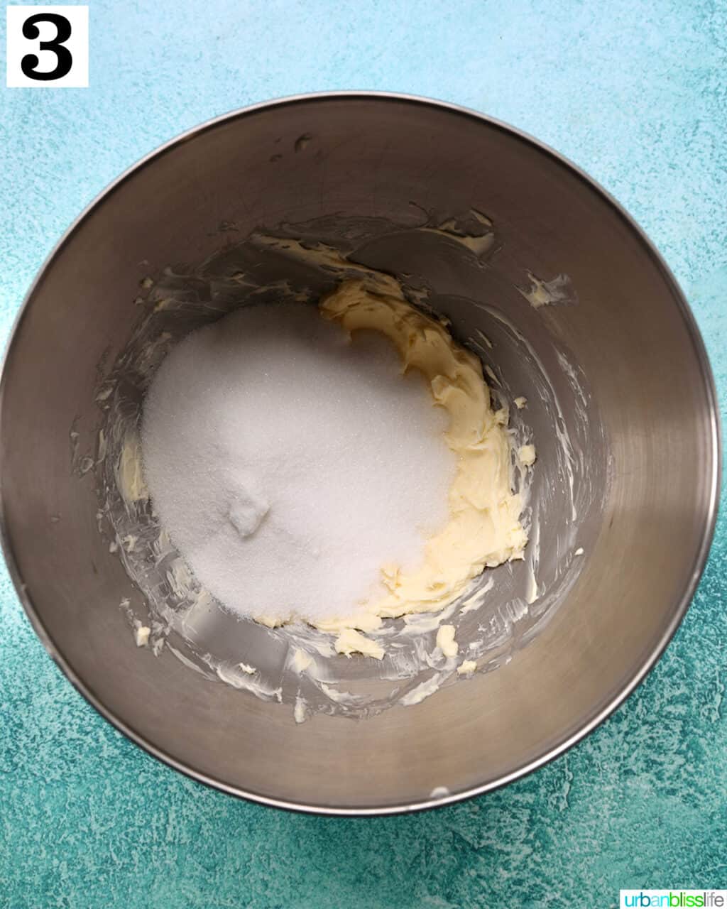 butter and sugar in a stainless steel bowl.