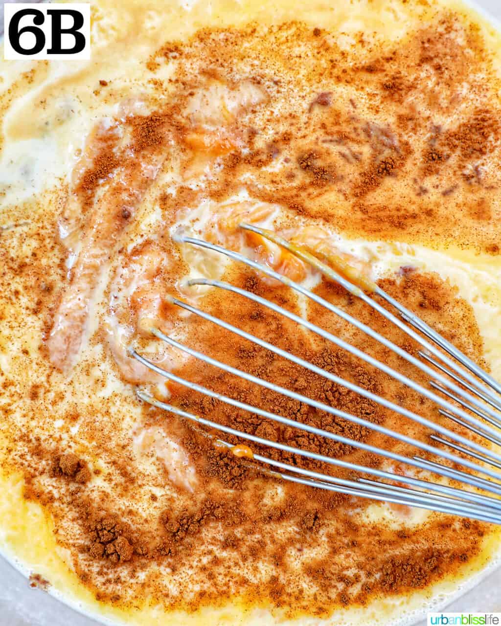 whisking sweet potato pie mix with eggs and spices.