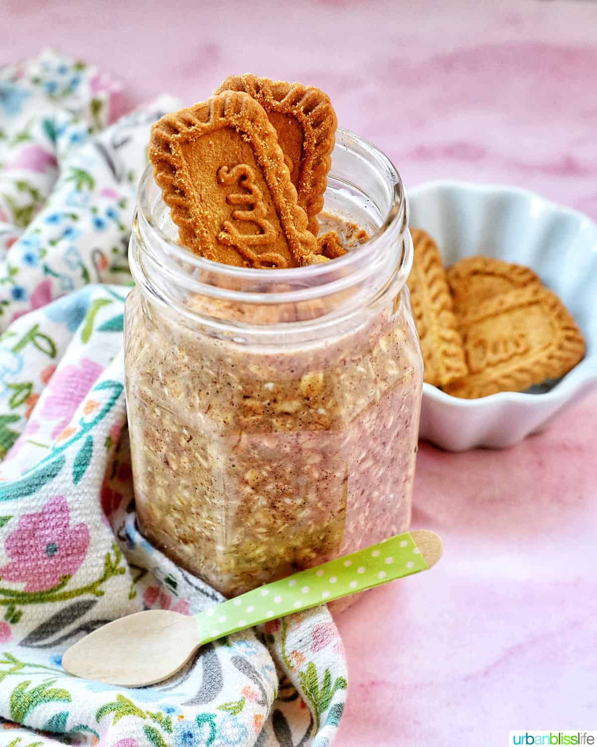 Biscoff overnight oats in a jar with crumbled Biscoff cookies on top.