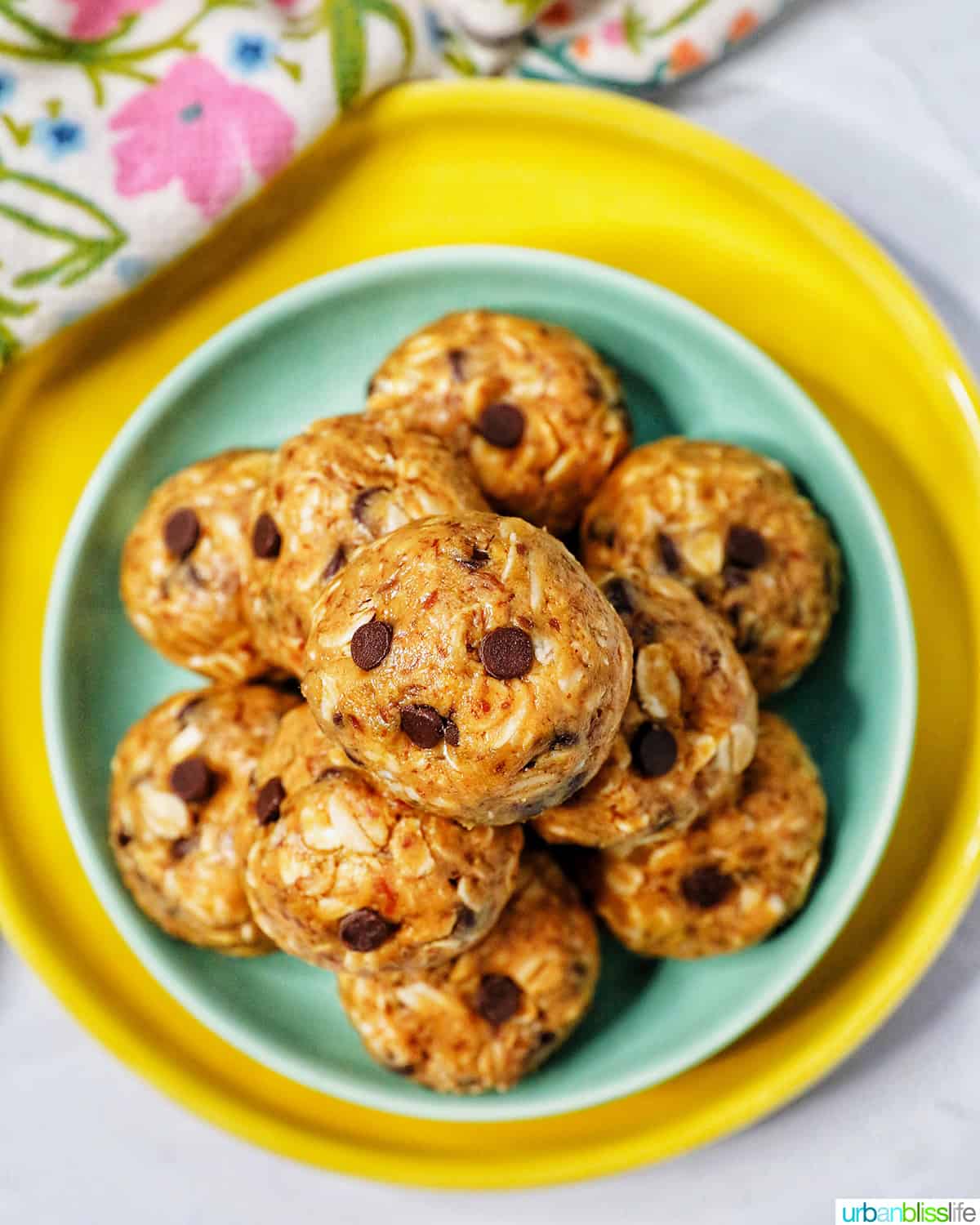 stack of Peanut Butter Chocolate Chip Oatmeal Balls on a green and yellow plate.