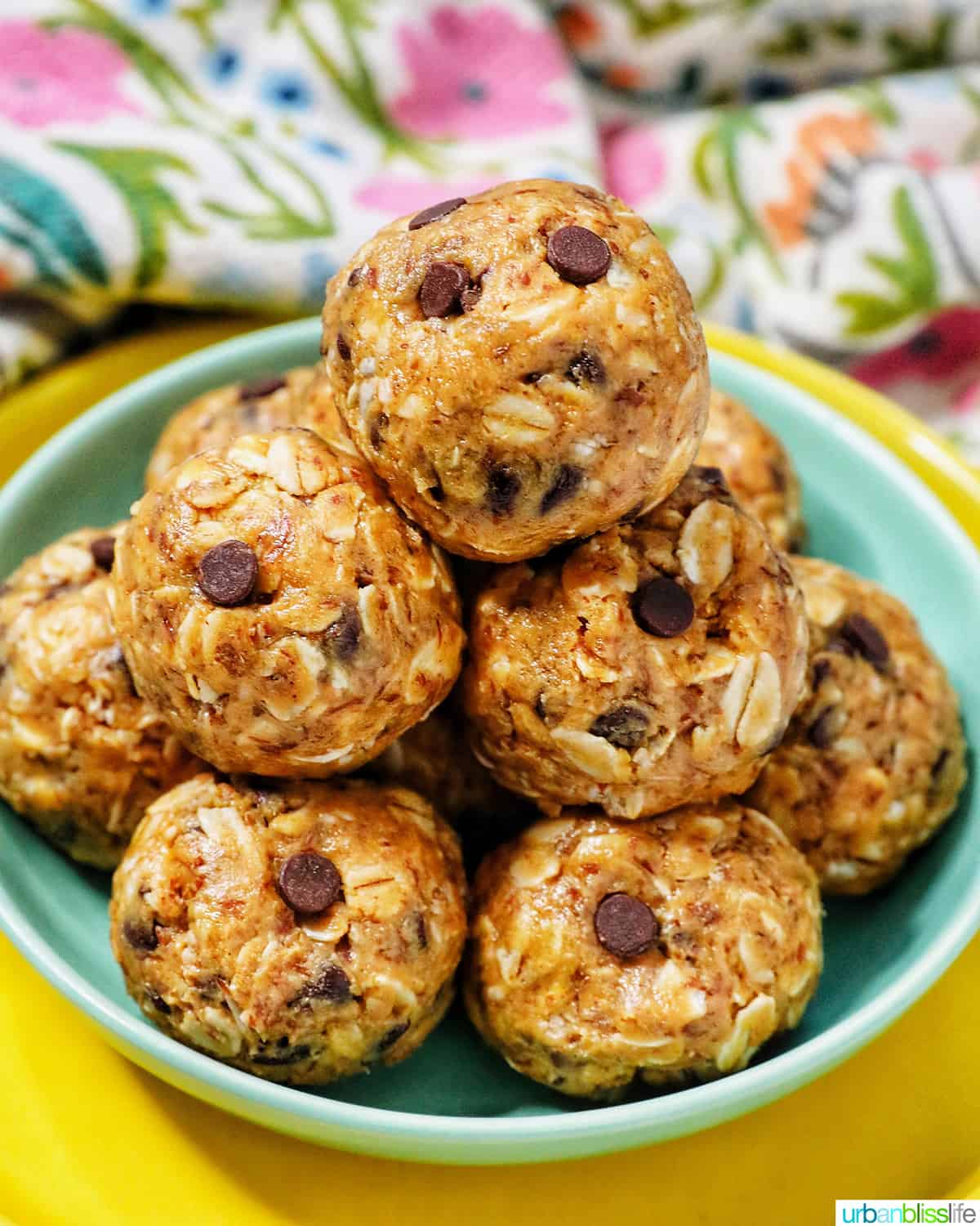 stack of Peanut Butter Chocolate Chip Oatmeal Balls on a green and yellow plate.