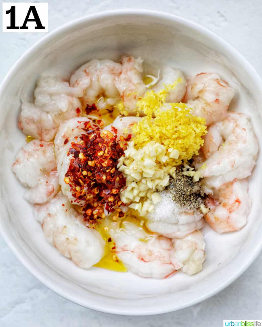 raw shrimp with minced garlic, red pepper flakes, and lemon zest and herbs.