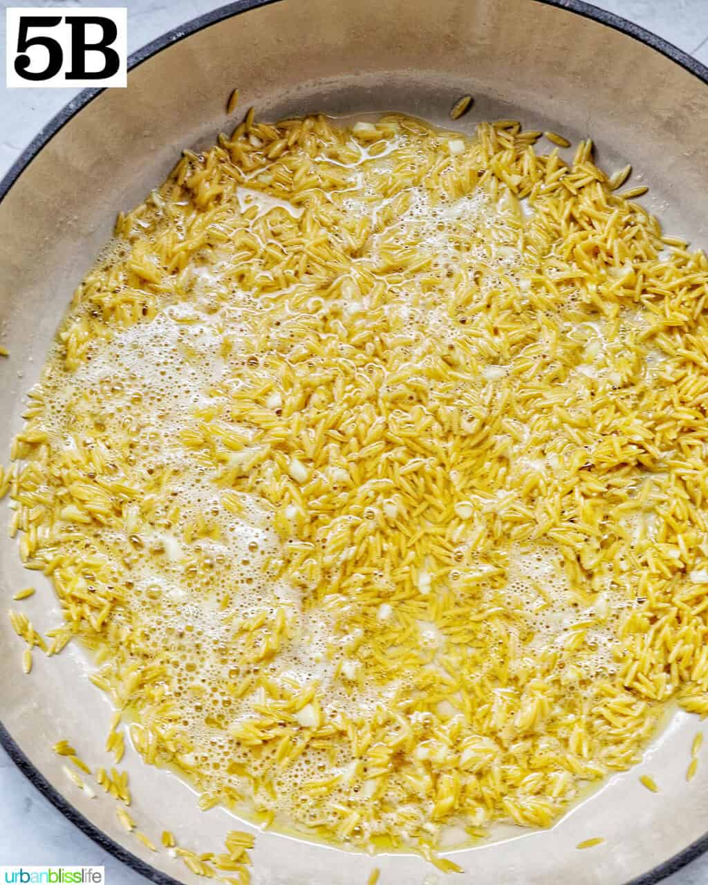orzo cooking in white wine.