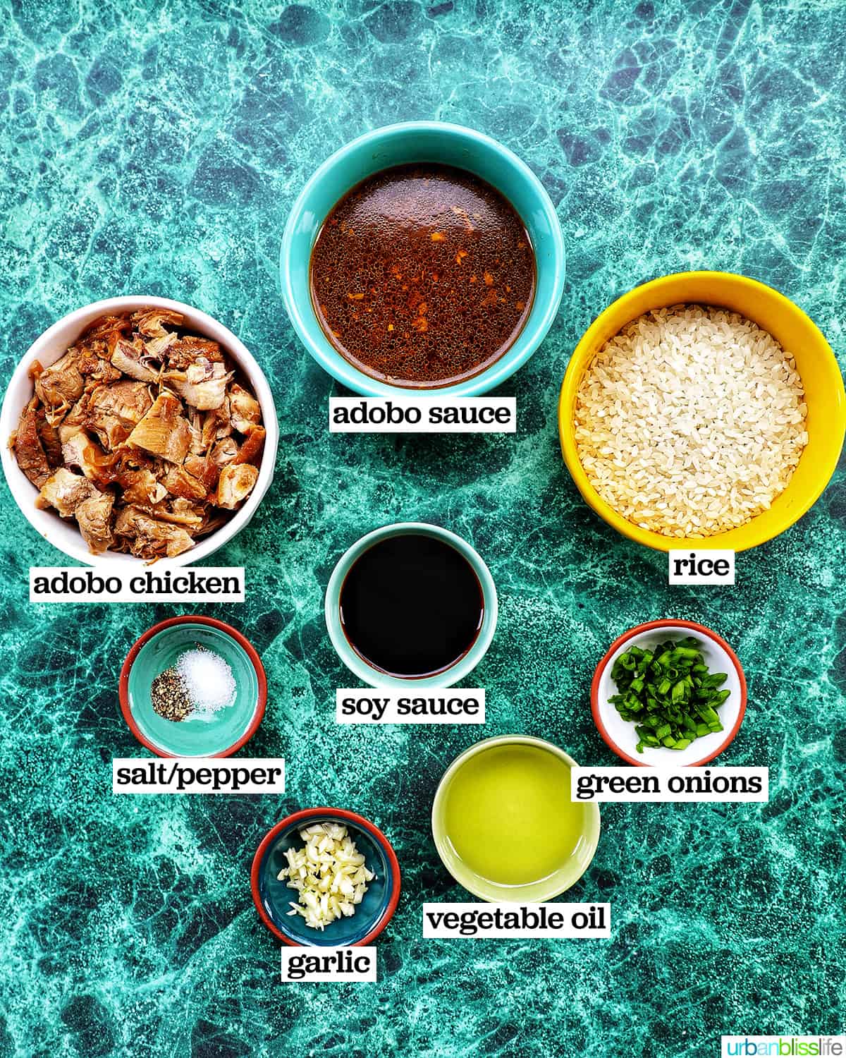 bowls of ingredients to make adobo fried rice.