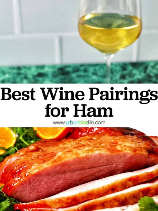 glass of white wine behind honey glazed ham sliced with oranges and herbs, and title text overlay.