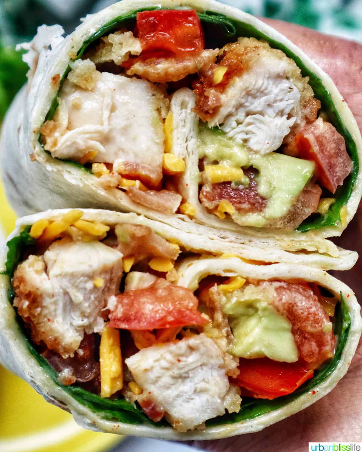 honey mustard chicken wraps sliced in half with the middle exposed.