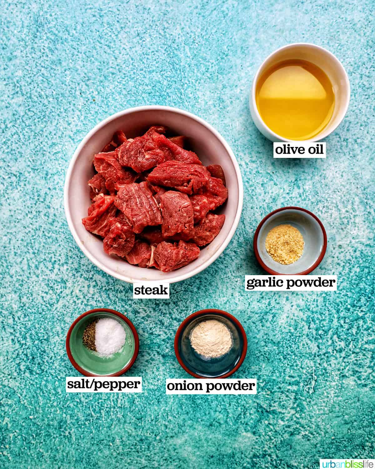 ingredients to make air fryer steak tips in bowls.