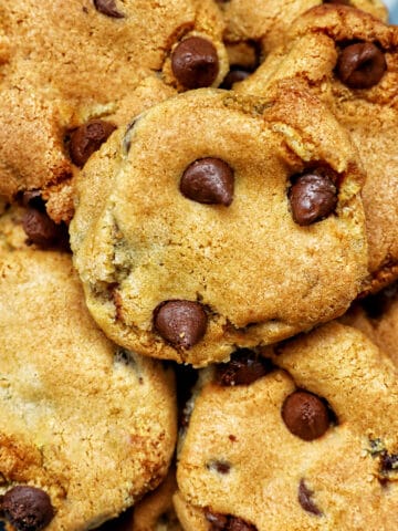 stack of air fryer chocolate chip cookies on a plate.