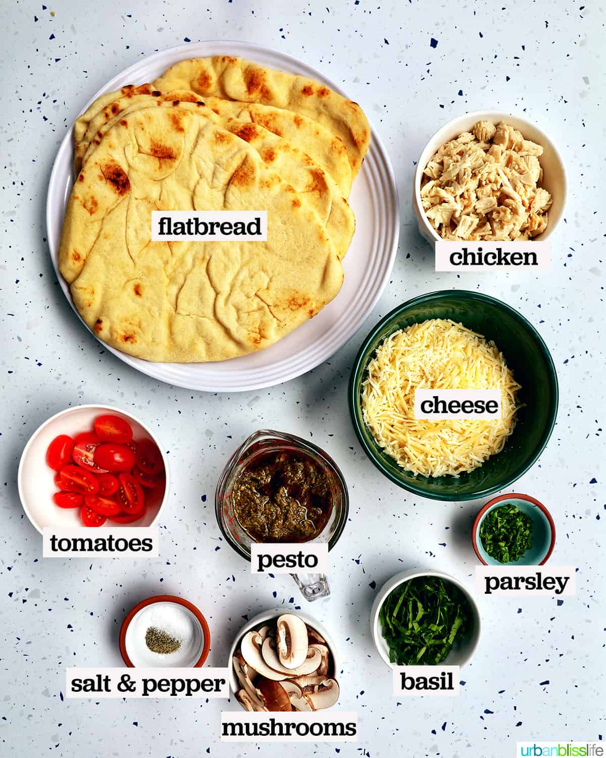 ingredients to make chicken pesto flatbread with text overlay.