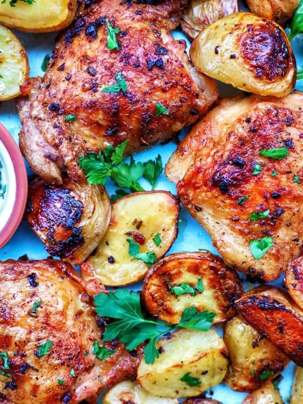 chicken and potatoes garnished with parsley.