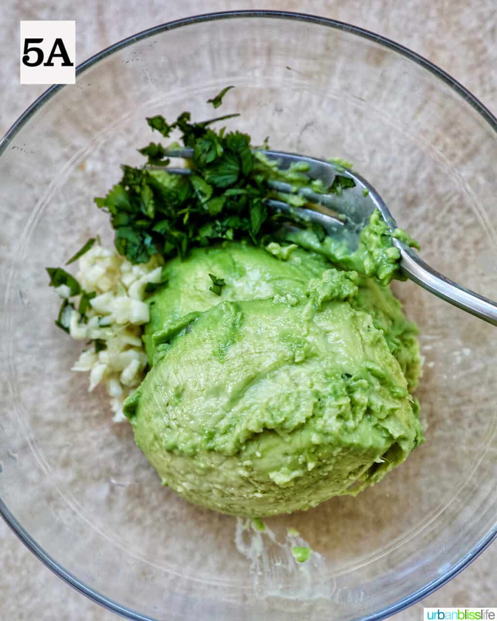 bowl with ingredients to make guacamole.