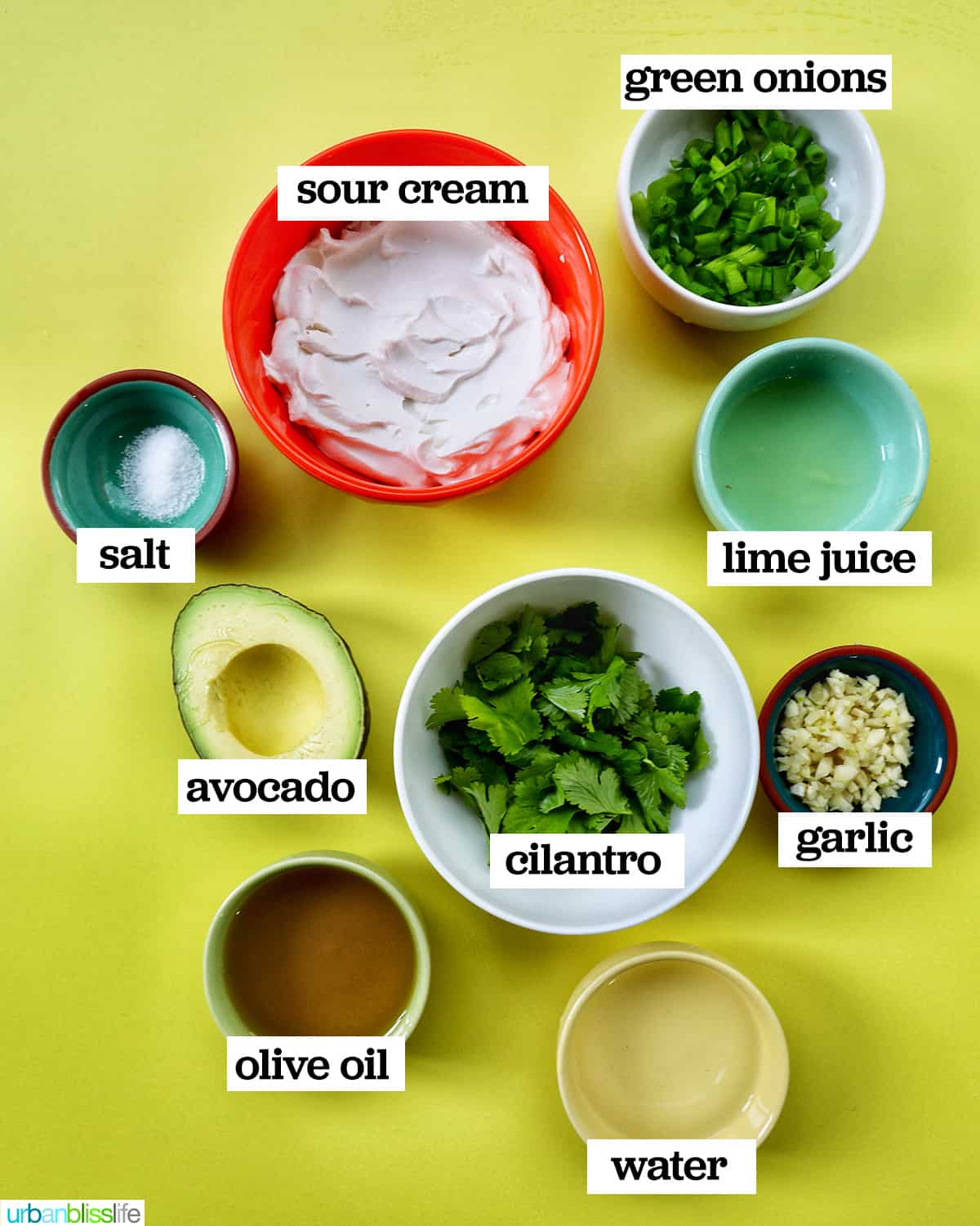bowls of ingredients to make avocado cilantro lime crema.