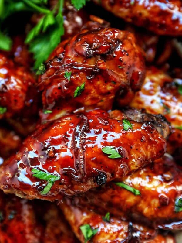 bowl of Filipino adobo chicken wings and fresh parsley.