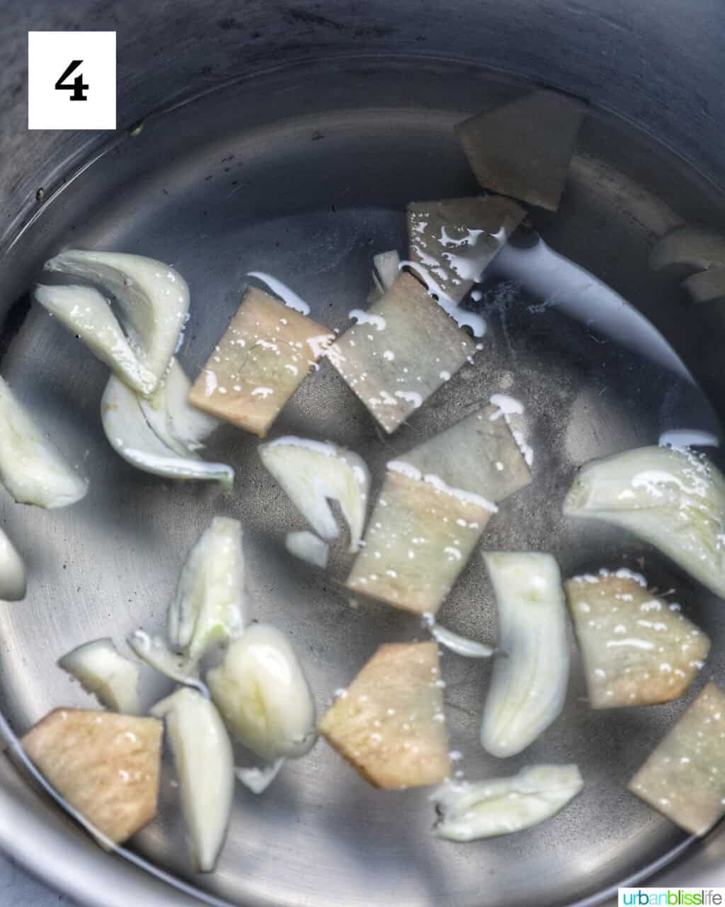 sliced garlic and ginger in a pot of water.