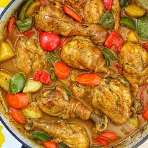 Filipino Chicken Curry with vegetables in a large pan.